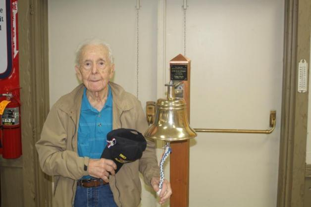 Joe Caminiti, World War II veteran and Iwo Jima survivor, rang the USS Kidd ship bell.