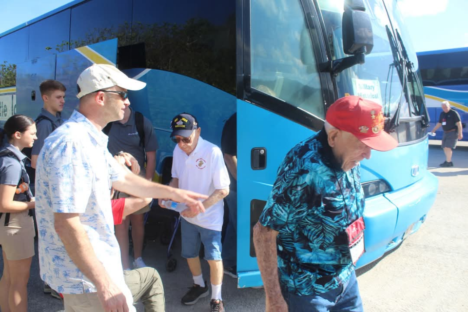 World War II veteran and Iwo Jima survivor Joe Caminiti departs his bus in Guam