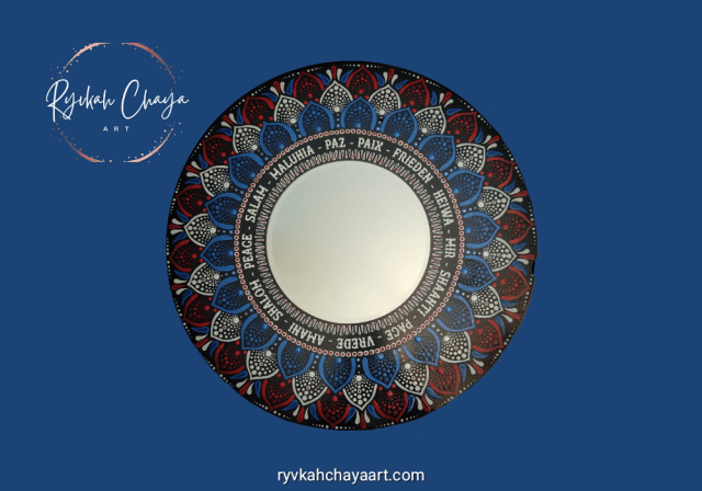 hand-painted red, white, and blue mandala mirror from Ryvkah Chaya Art.